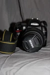 Nikon D5000 Camera Bundle 18-55MM Vr Zeikos Telephoto Wide Lenses Bag. Fixed Price $200.00.