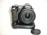 Nikon Coolpix Digital Camera 5MP 8X Zoom With MB-E5700 Grip Powers. Fixed Price $36.90.
