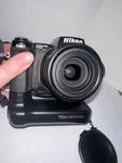 Nikon Coolpix Digital Camera + MB-E5700 Grip, Filters, Accessories Untested. Fixed Price $64.71.