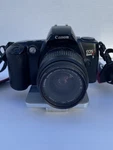 Canon Eos Rebel Xs 35MM Film Slr Camera W/ Tiffen 52MM Lens -powers Read. Fixed Price $70.00.
